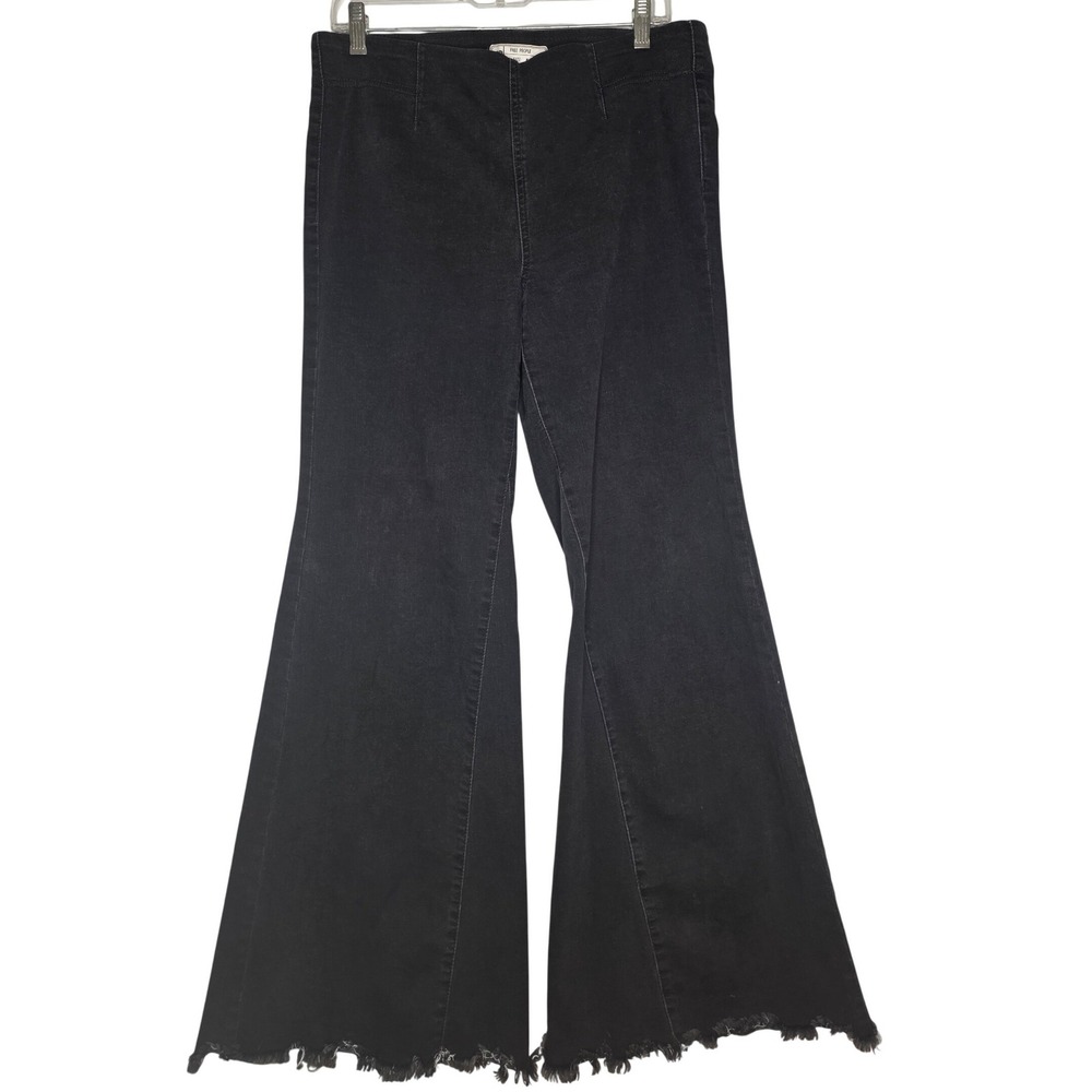 Free People Black Jeans Flare Raw Hem Stretch pull on flat front Size 31‎